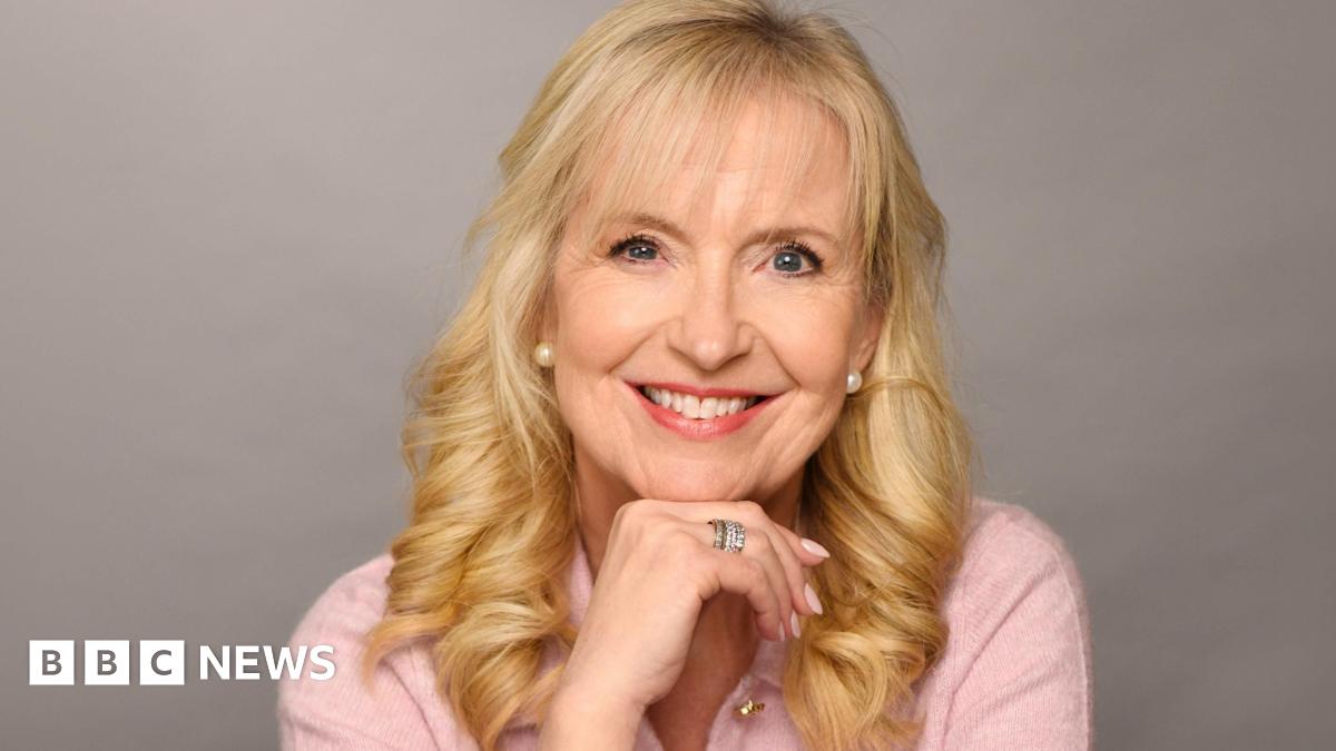 Outgoing BBC Weather presenter Carol Kirkwood smiles in a portrait taken to mark her departure from the BBC. She is wearing a light pink top.