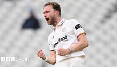 Essex's Sam Cook celebrates taking a wicket against Warwickshire