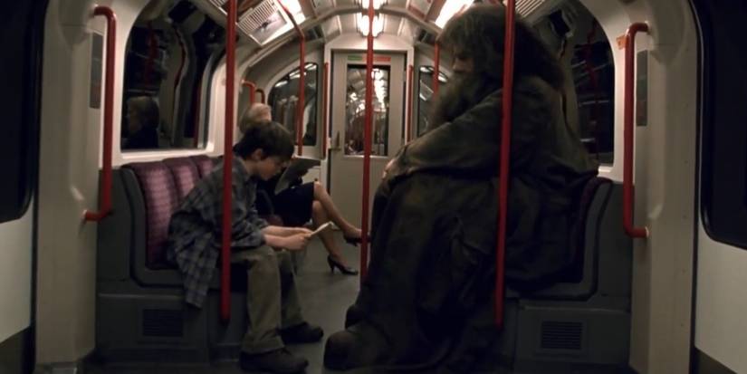 Daniel Radcliffe as Harry and Robbie Coltrane as Hagrid on the London Underground in Harry Potter and the Sorcerer's Stone (2001)
