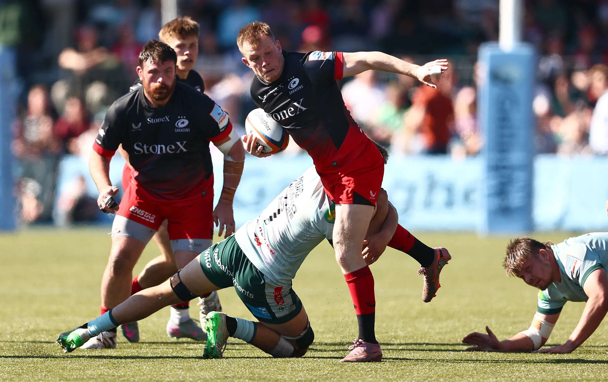 Nick Tompkins of Saracens is tackled during a Gallagher PREM match.