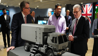 Former UK ambassador to the United States Lord Mandelson and Prime Minister Keir Starmer (R) tour Palantir Technologies headquarters with company employees and British military personnel on 27 February 2025 in Washington, DC.