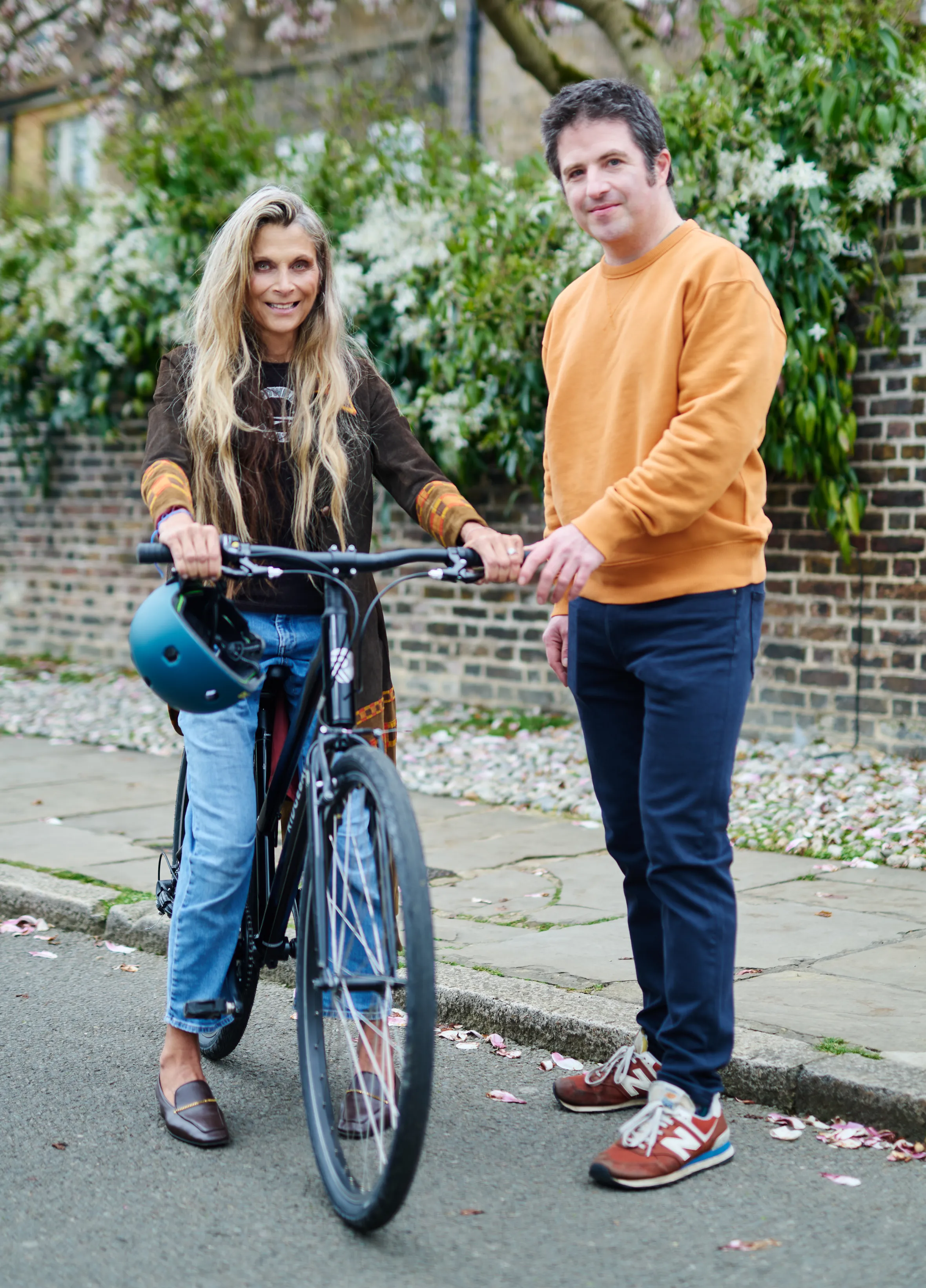 Christa D'Souza and her teacher Ed with a bicycle.