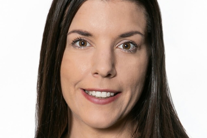 A headshot of a woman on a white background.