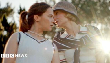 Carey Mulligan and Oscar Isaac sit together on a sofa, looking at a younger couple, played by Charles Melton and Cailee Spaeny ,who are looking at each other