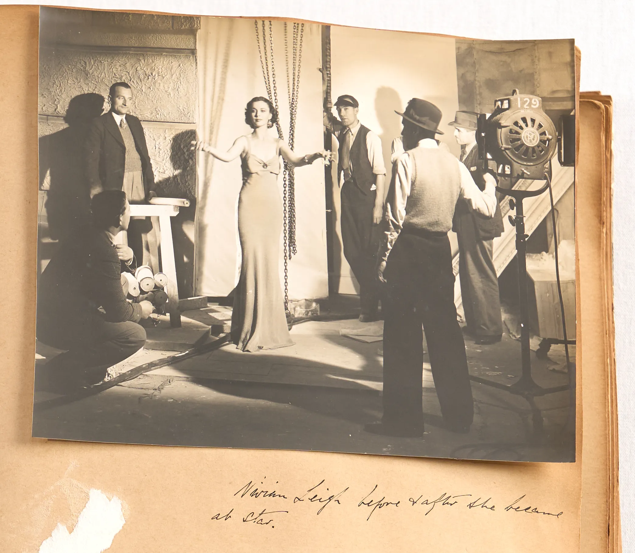 Collage of three black and white photographs in an open photo album.
