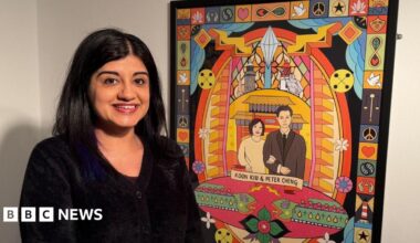 Sofia Barton, a middle-aged woman of South Asian heritage, standing next to a framed piece of digital artwork depicting Koon Kiu Cheng and her husband Peter Cheng, the founders of Newcastle's Chinatown. The design itself is bright and colourful, surrounded by symbols and patterns.