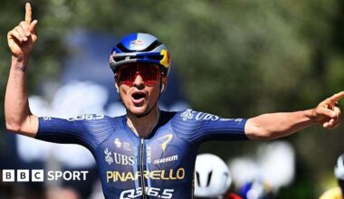 Tom Pidcock celebrates after winning stage 3 of the Tour of the Alps