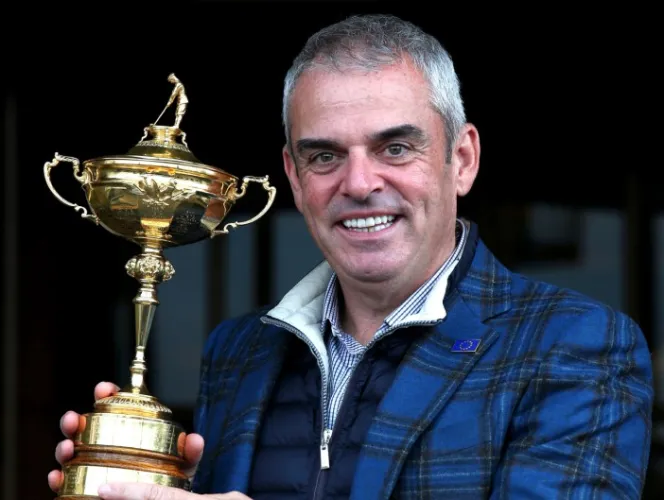 Paul McGinley posing with the Ryder Cup trophy.