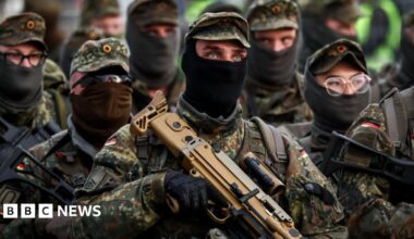 German army soldiers march at Hamburg Port terminal during the German Armed Forces and civilian authorities' military exercise 'Red Storm Bravo' in Hamburg, Germany, 25 September 2025
