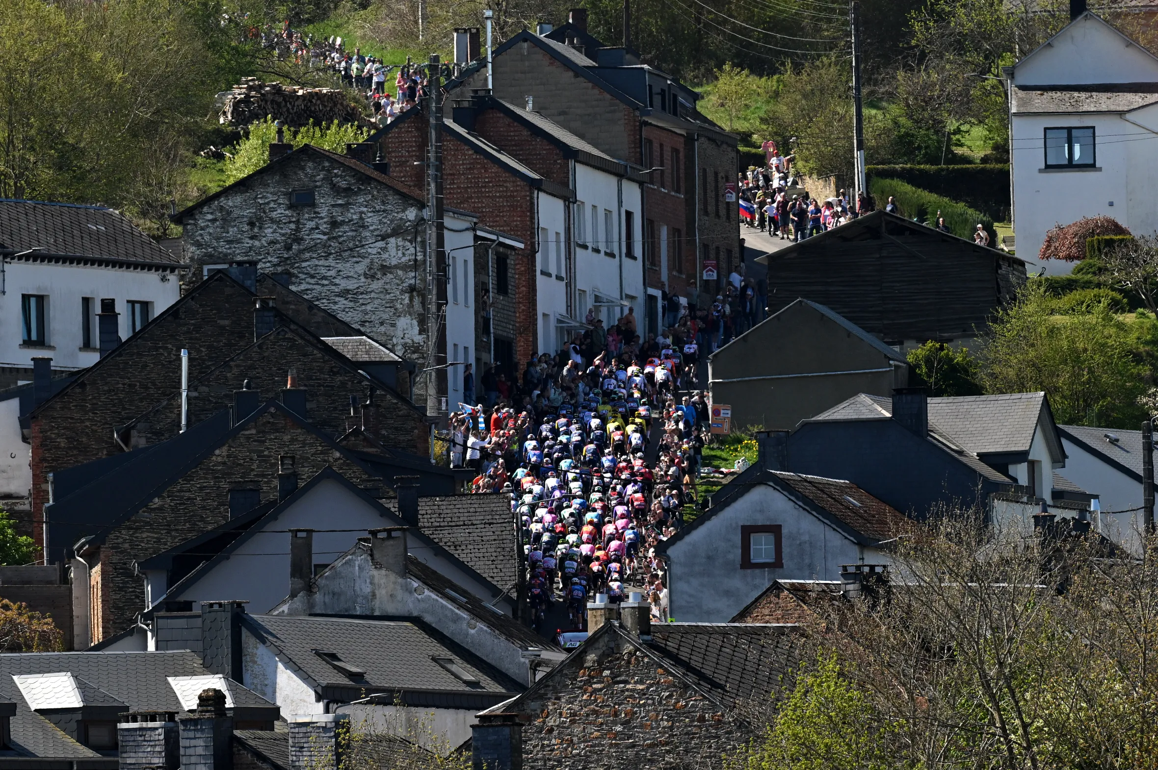 The peloton of the 112th Liege - Bastogne - Liege climbing the Cote de Saint-Roch.