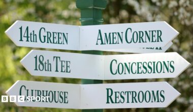 A sign at Augusta National Golf Club showing directions to Amen Corner, the 18th tee, concessions, the clubhouse and restrooms