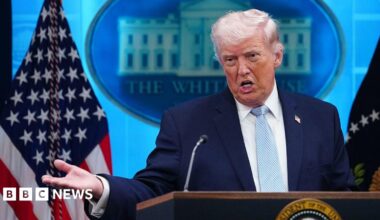 Donald Trump speaking at the podium on 5 April.