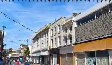 Closed high street with shops and buildings in traditional style. The lively coastal town center of Dover, Kent county, England