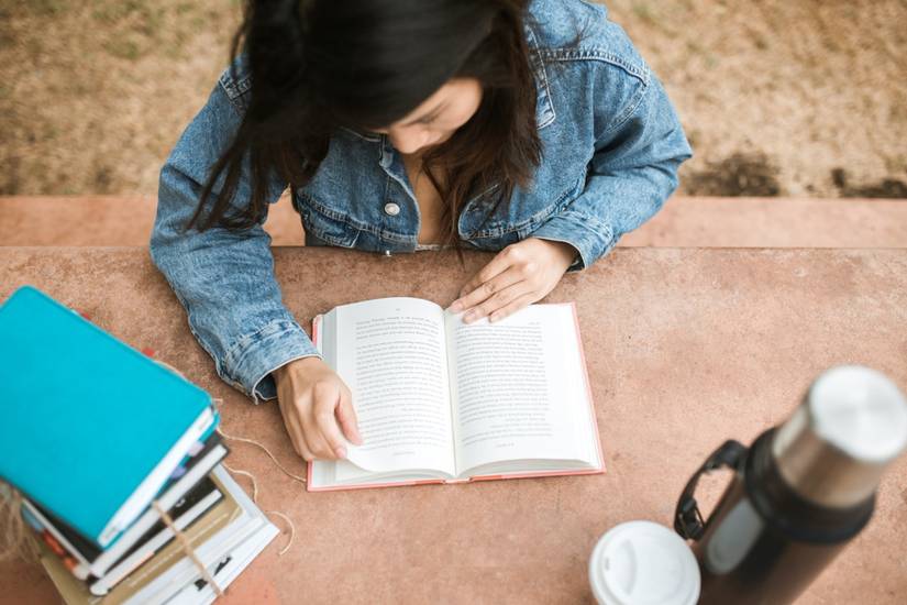 A young lady reading a book