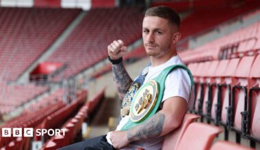 Ryan Garner poses for a photo while sat in St Mary's Stadium