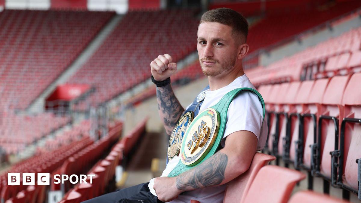 Ryan Garner poses for a photo while sat in St Mary's Stadium