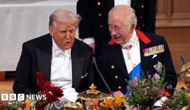 President Trump and King Charles laugh and talk sitting at the table at the banquet while the president was on a trip to the UK in September.