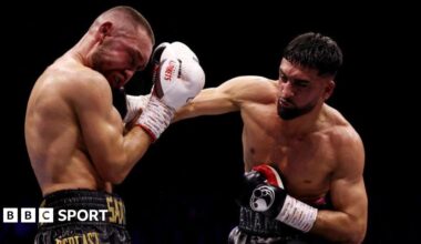 Adam Azim throws a punch in the ring