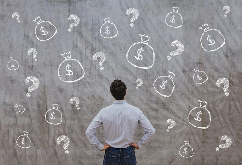 A person looks at a gray background with illustrated question marks and moneybags.