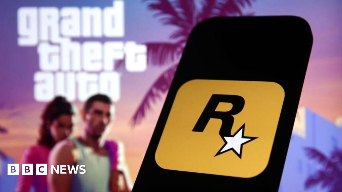 Rockstar Games logo displayed on a smartphone, against a backdrop of assets promoting GTA 6 - showing characters Lucia and Jason against a colourful sunset and palm trees.