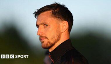 Dom Hyam looks on as he arrives at the ground