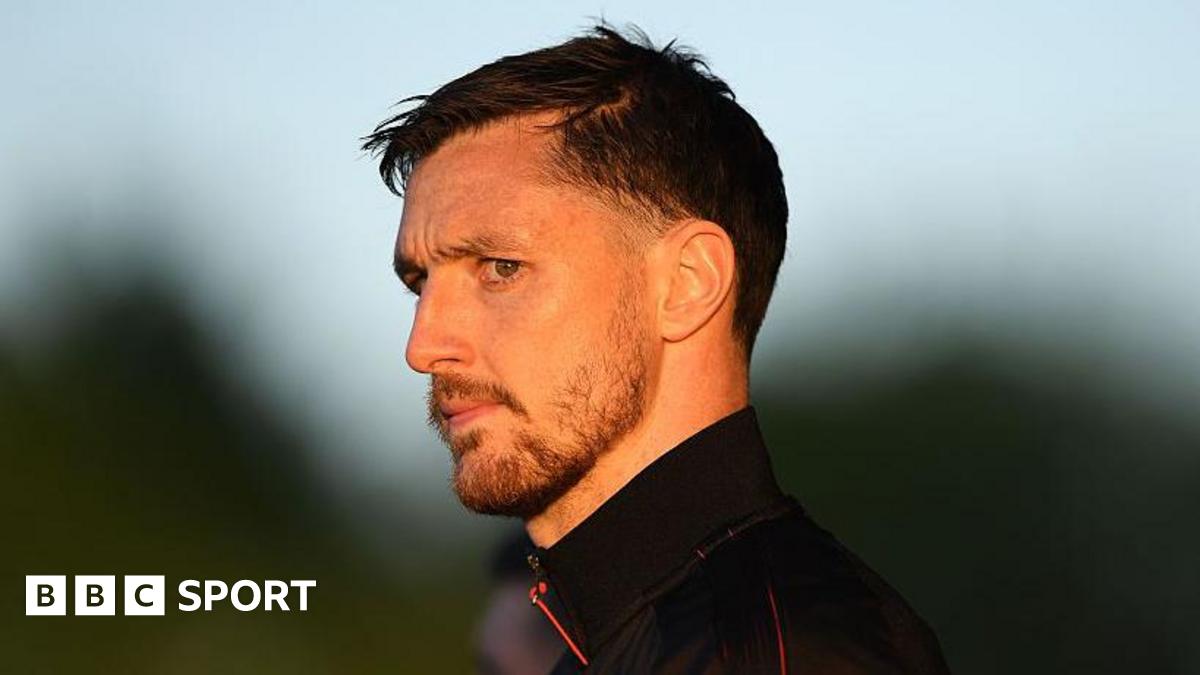 Dom Hyam looks on as he arrives at the ground