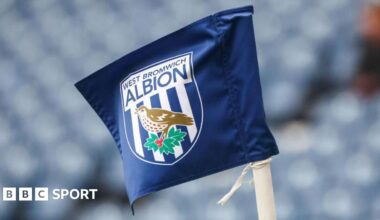 A corner flag with the West Brom badge