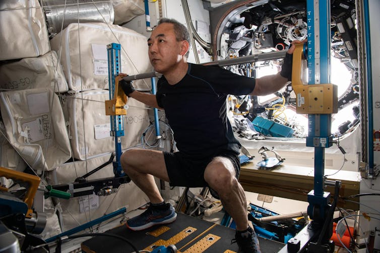 Japanese astronaut Satoshi Furukawa works out on the International Space Station.