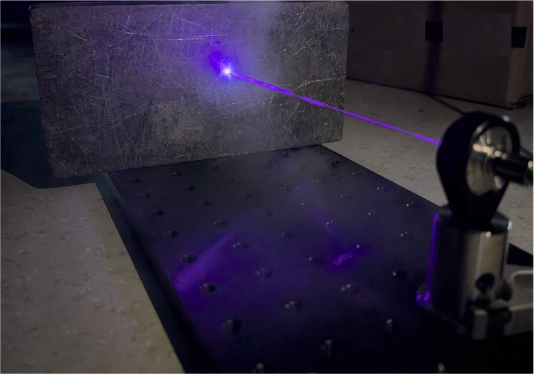 A laser beam shot at an opaque material
