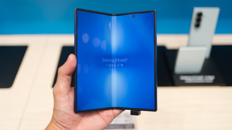 A hand holding a Samsung Galaxy Z Fold7 phone