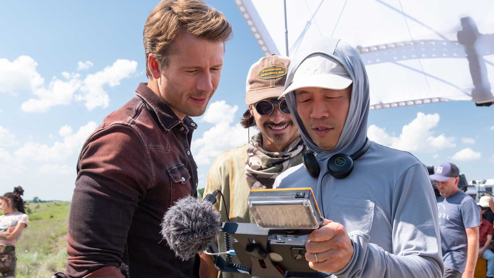Glen Powell and Lee Isaac Chung on the set of Twisters