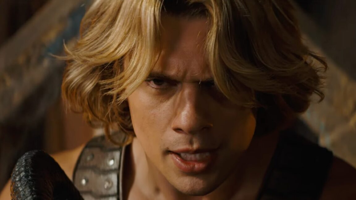 closeup of a young He-Man with a fiercely determined expression on his young face
