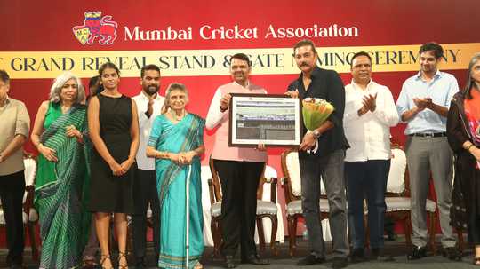 in-presence-of-family-ravi-shastri-receives-a-picture-of-the-eponymous-stand-at-wankhede-stadium-from-maharashtra-chief-minister-devendra-fadnavis