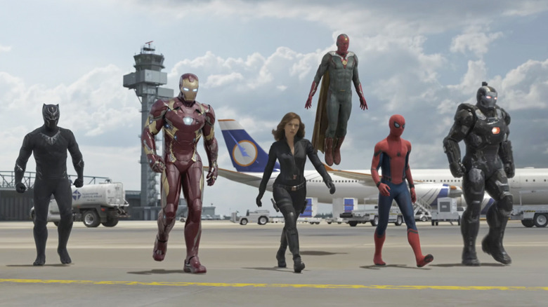 Black Panther, Iron Man, Black Widow, Vision, Spider-Man, and War Machine walking in a line before the airport battle in Captain America: Civil War