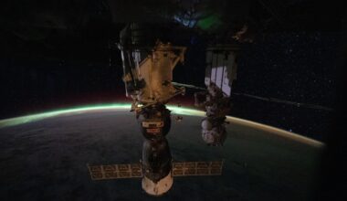 The aurora australis arcs above Earth’s horizon and fades into the airglow as the International Space Station orbited 265 miles above the Indian Ocean east of Perth, Australia, at approximately 2:03 a.m. local time. In the foreground, the Soyuz MS-28 crew spacecraft is shown docked to the Rassvet module. In the background, the Pirs docking module is attached to the Nauka science module.