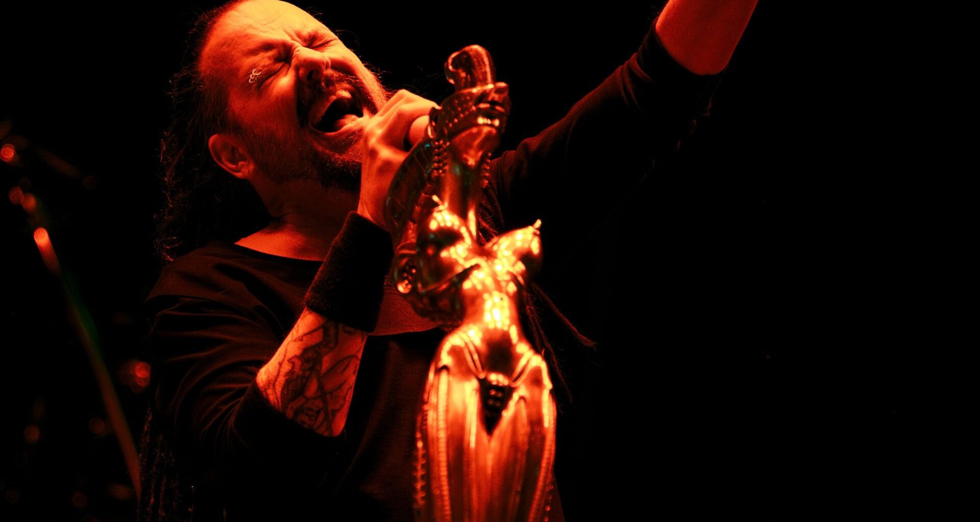 Watch KoRn play new song 'Reward The Scars' live for the first time to 50,000 people at Sick New World