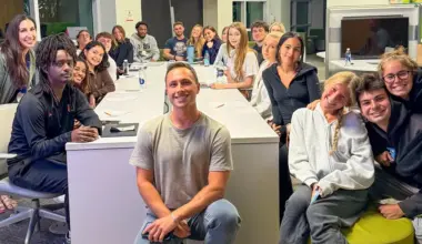 Rhonda Trust and her nutrition and communication class poses for a group photo with guest speaker Hunter Stoler, a certified health coach and content creator.