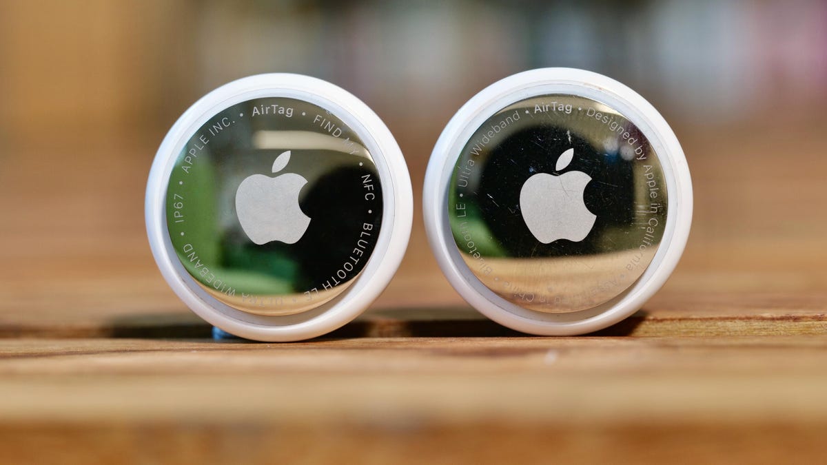 An AirTag 2nd-gen next the the first AirTag