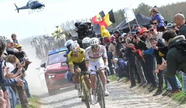 UAE Team Emirates-XRG's Slovenian rider Tadej Pogacar cycles in a breakaway on a cobblestone sector ahead of Team Visma - Lease a Bike's Belgian rider Wout van Aert during Paris-Roubaix