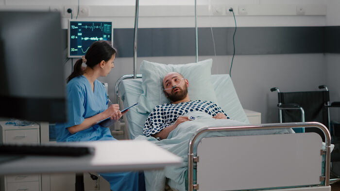 Surgical staff interacting with a patient in a hospital bed, revealing unusual patient confessions under sedation.