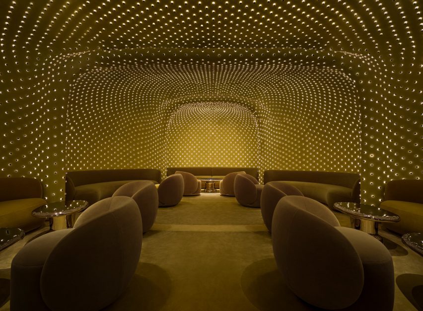 Tiny lights cover the walls and ceiling of a windowless lounge