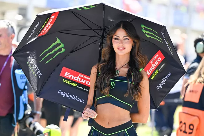 Pertamina Enduro VR46 Racing umbrella girl on the grid.