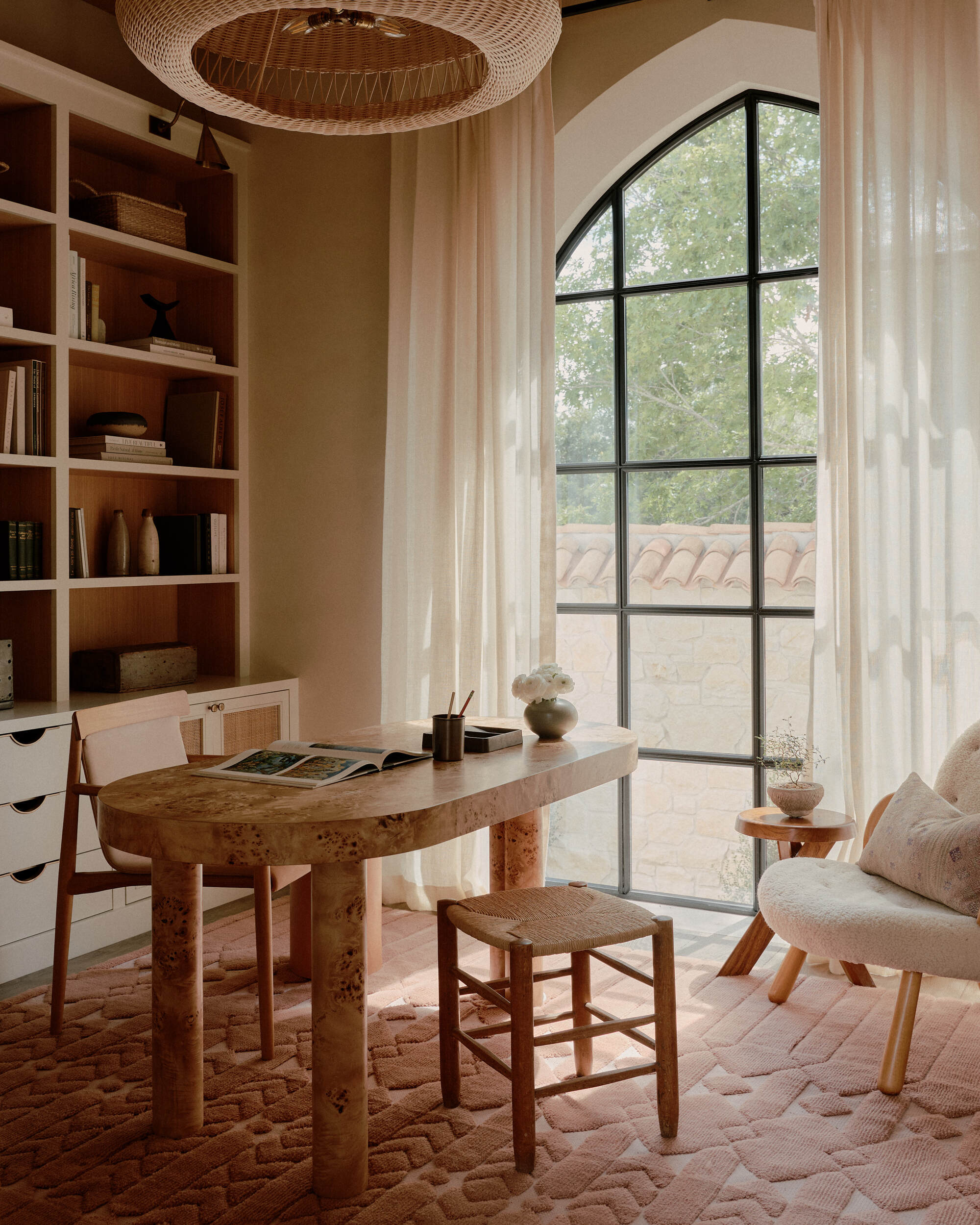 a mediterranean style study with sheer curtains