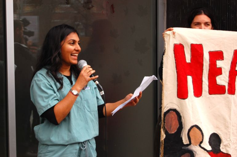Toronto-based family doctor Ritika Goel speaks during a rally in Toronto, Canada