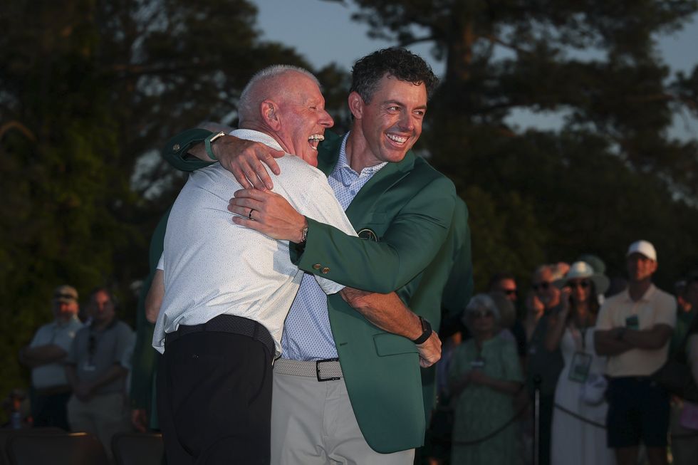 Rory McIlroy shares a hug with his father, Gerry, following his Masters triumph at Augusta