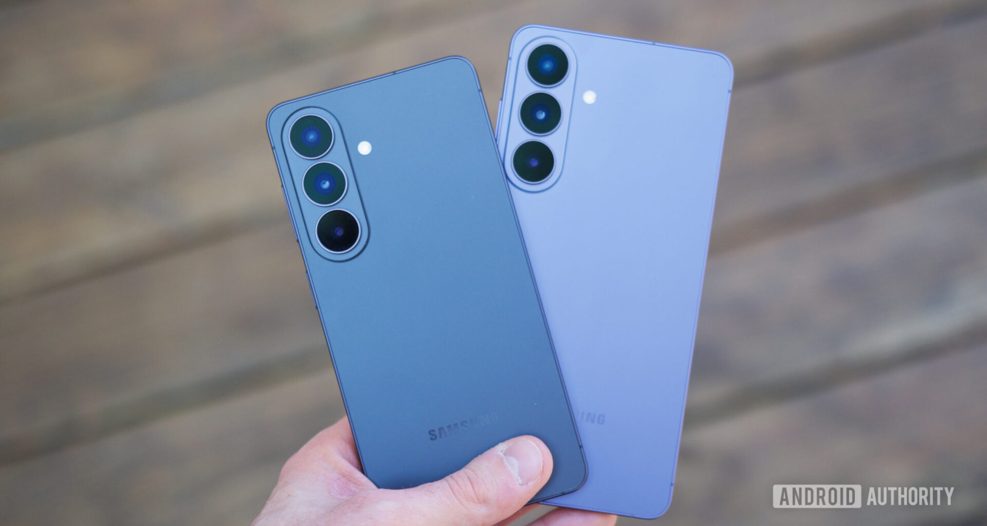 Someone holding the Samsung Galaxy S26 and Galaxy S26 Plus.