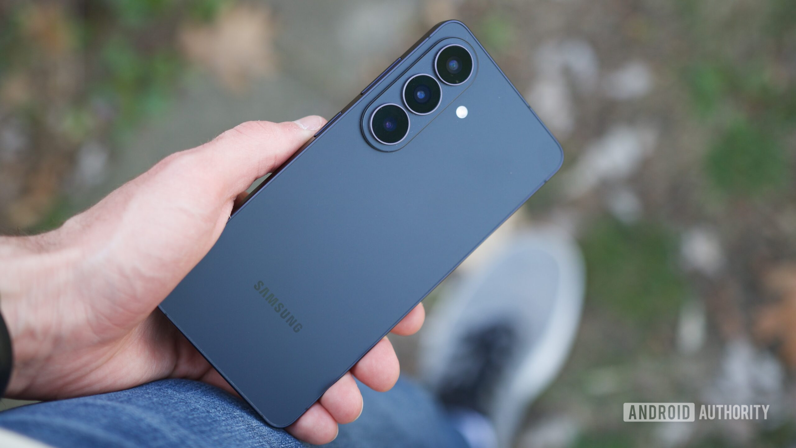 Someone holding the Galaxy S26, showing the back of the phone.