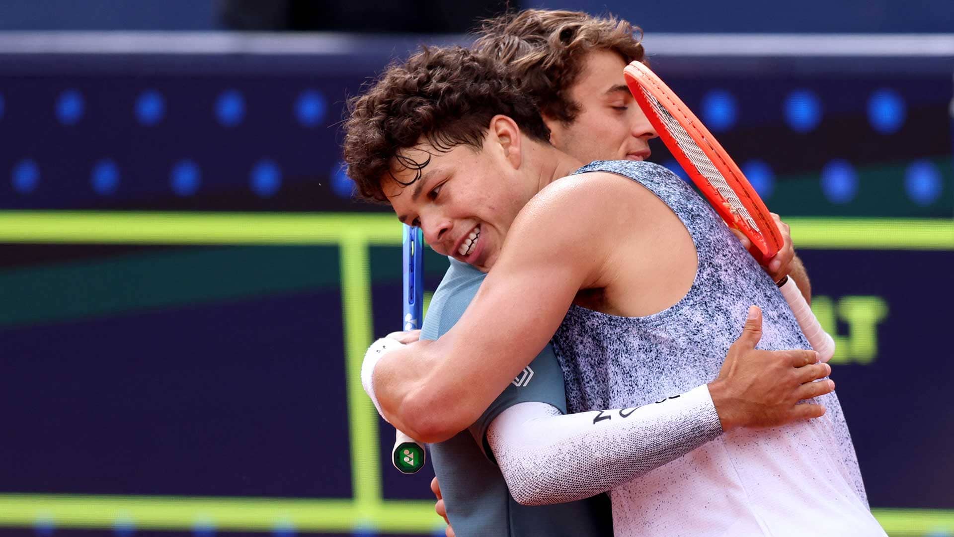 Ben Shelton and Flavio Cobolli embrace following the Munich final on Sunday.