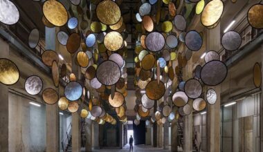 SpY suspends rotating gold and silver halos inside florence atrium