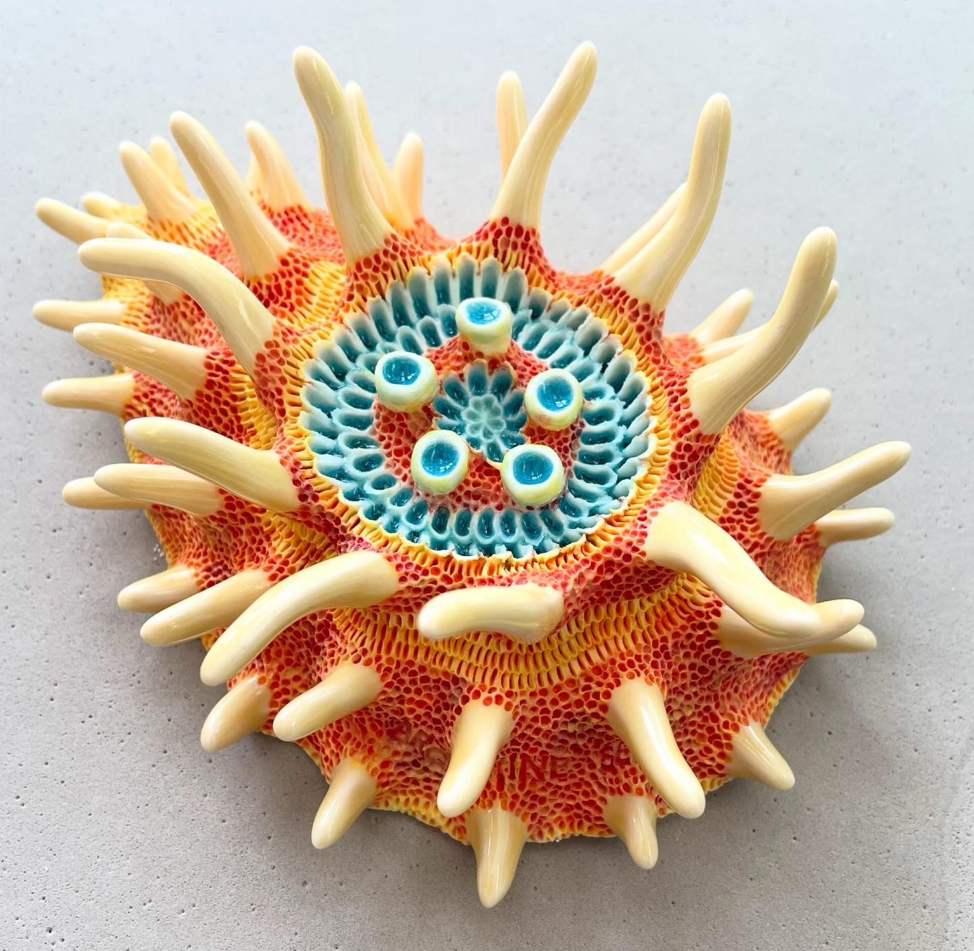 a coral-inspired, colorful ceramic sculpture by Lisa Stevens